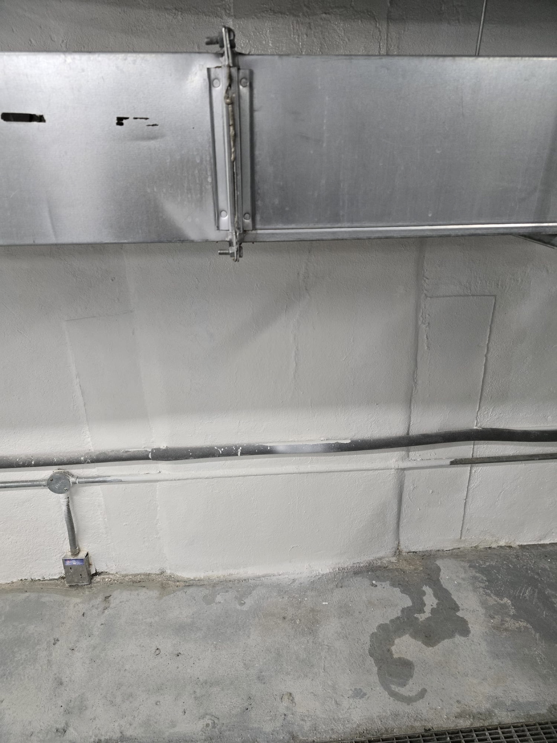 cycle-bay west wall — paint, line marker, channel — Completed