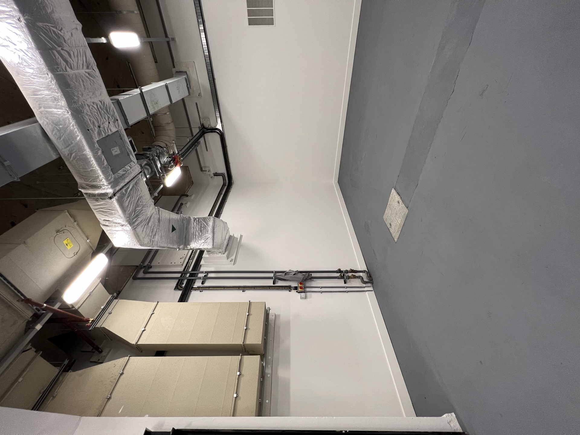 cycle-bay west wall — paint, line marker, channel — Existing