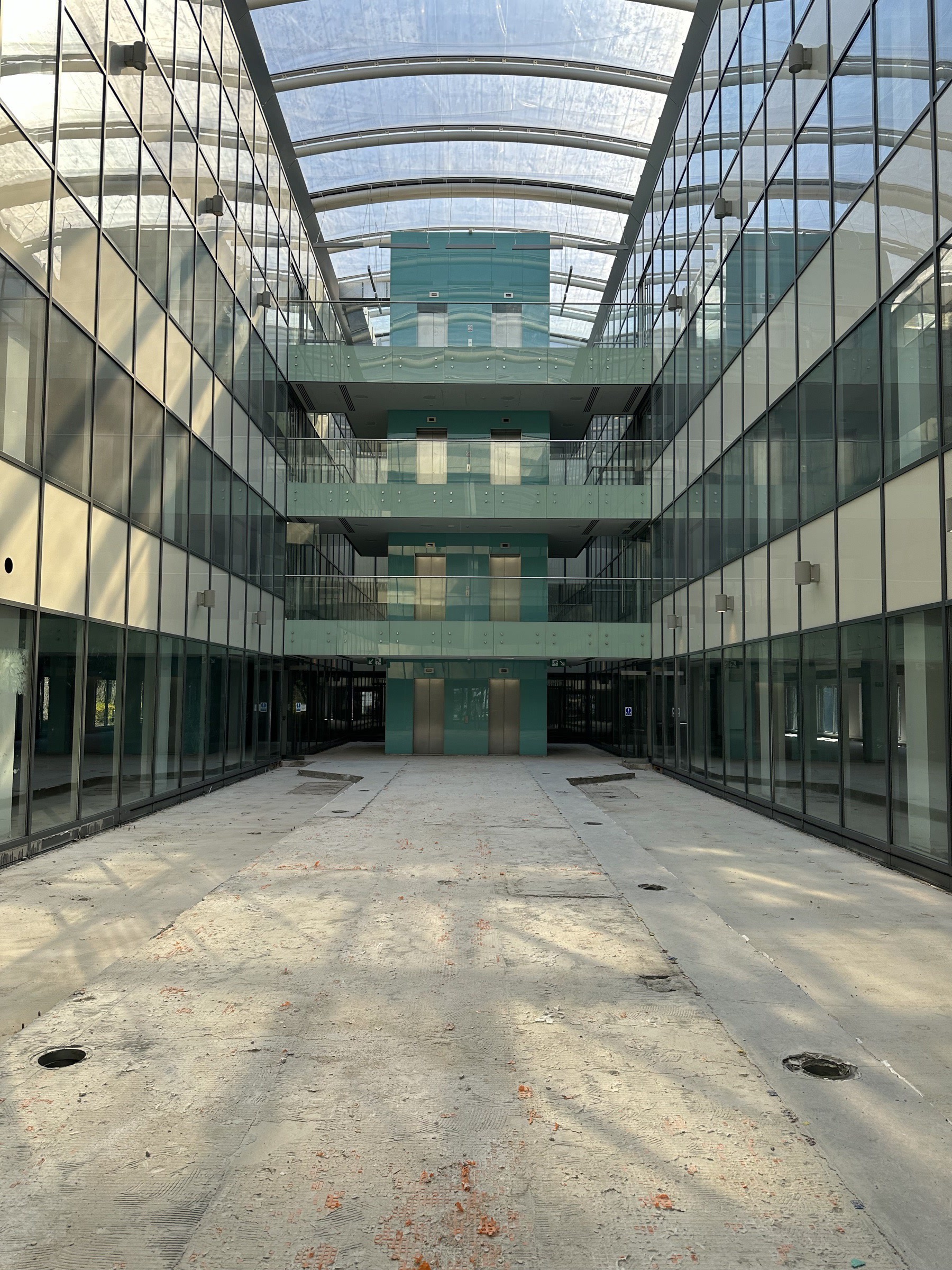 Post-strip — concrete shell, lift core revealed