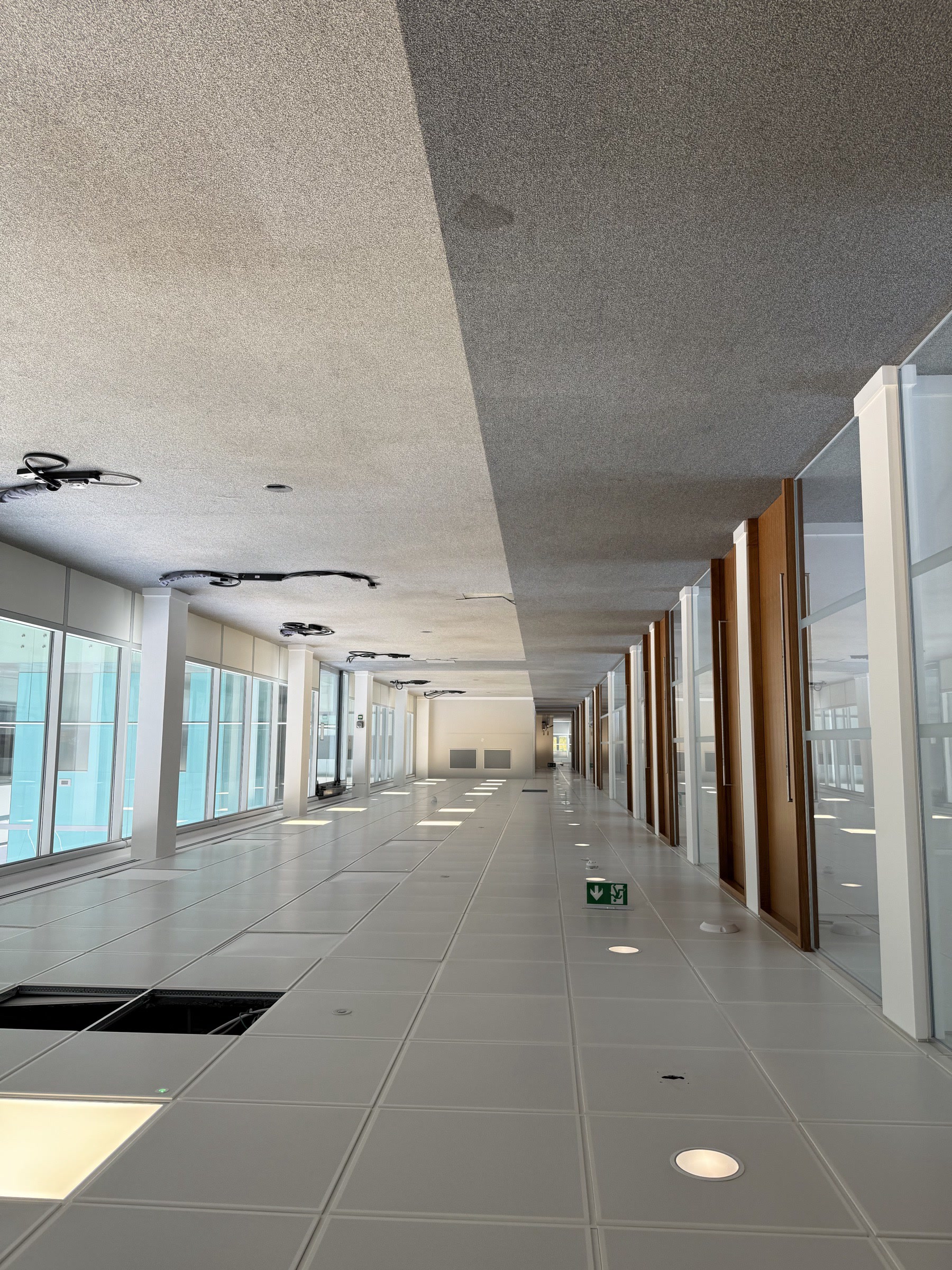 Atrium walkway — glass balustrade corridor — Before